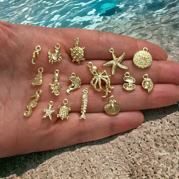 Earrings Peppy Beads 24Kt Gold Plated Under The Sea Charms Collection 16 Charms in a pack Earrings Peppy Beads 24Kt Gold Plated Under The Sea Charms Collection 16 Charms in a pack